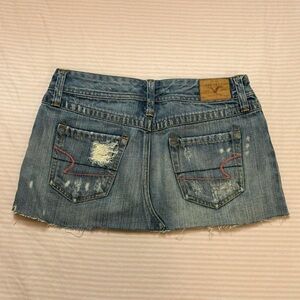 00s distressed American Eagle mini skirt with pink embroidery